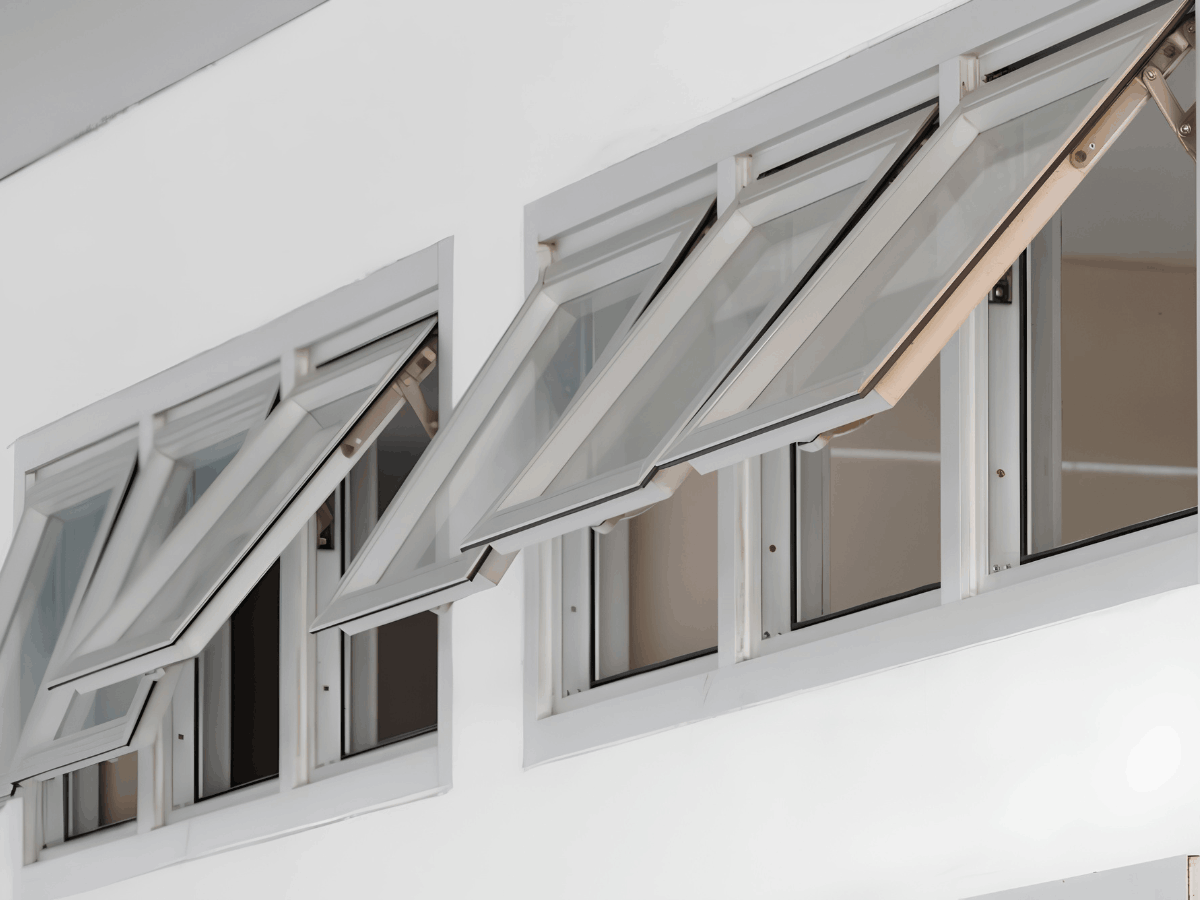 Row of white awning windows opened outward