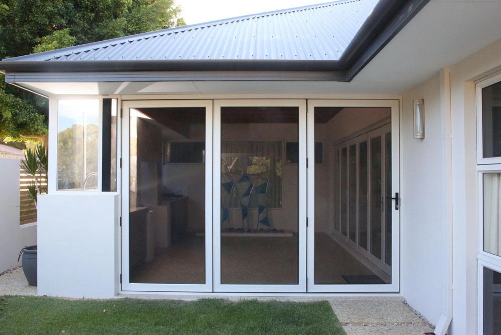 Security screen doors installed across a patio entrance by Clearview Security.
