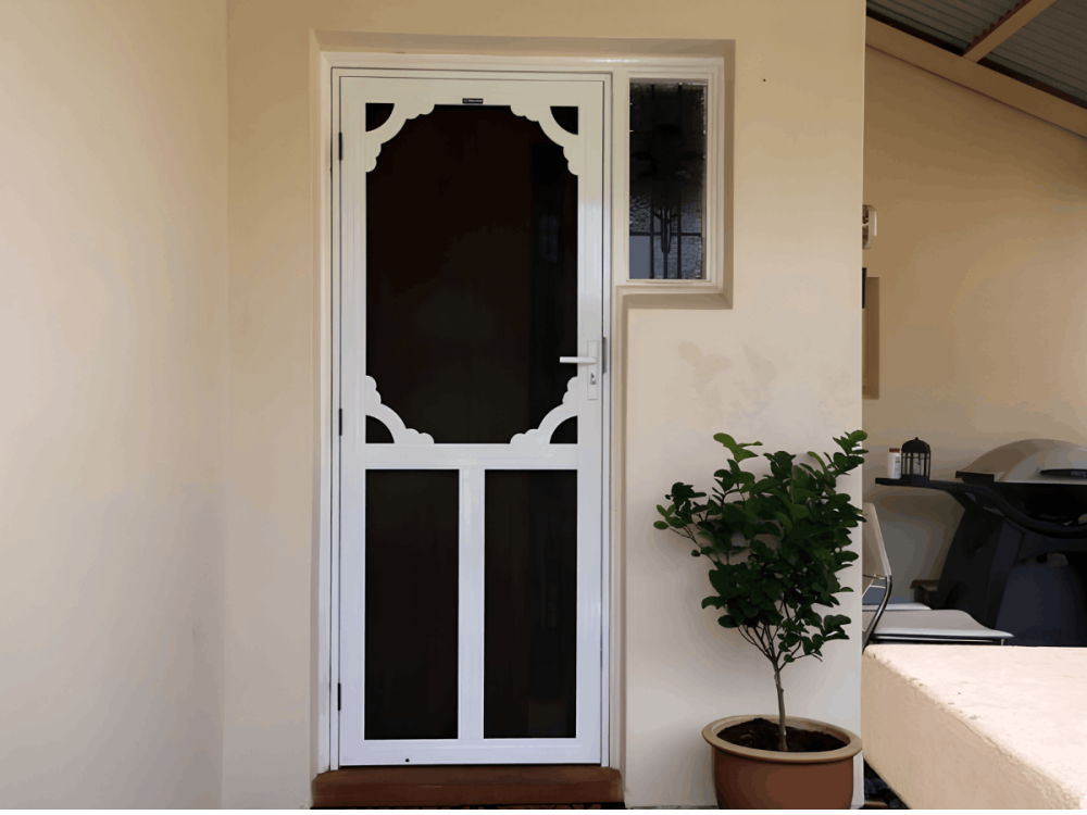 White decorative security screen door at an apartment entrance