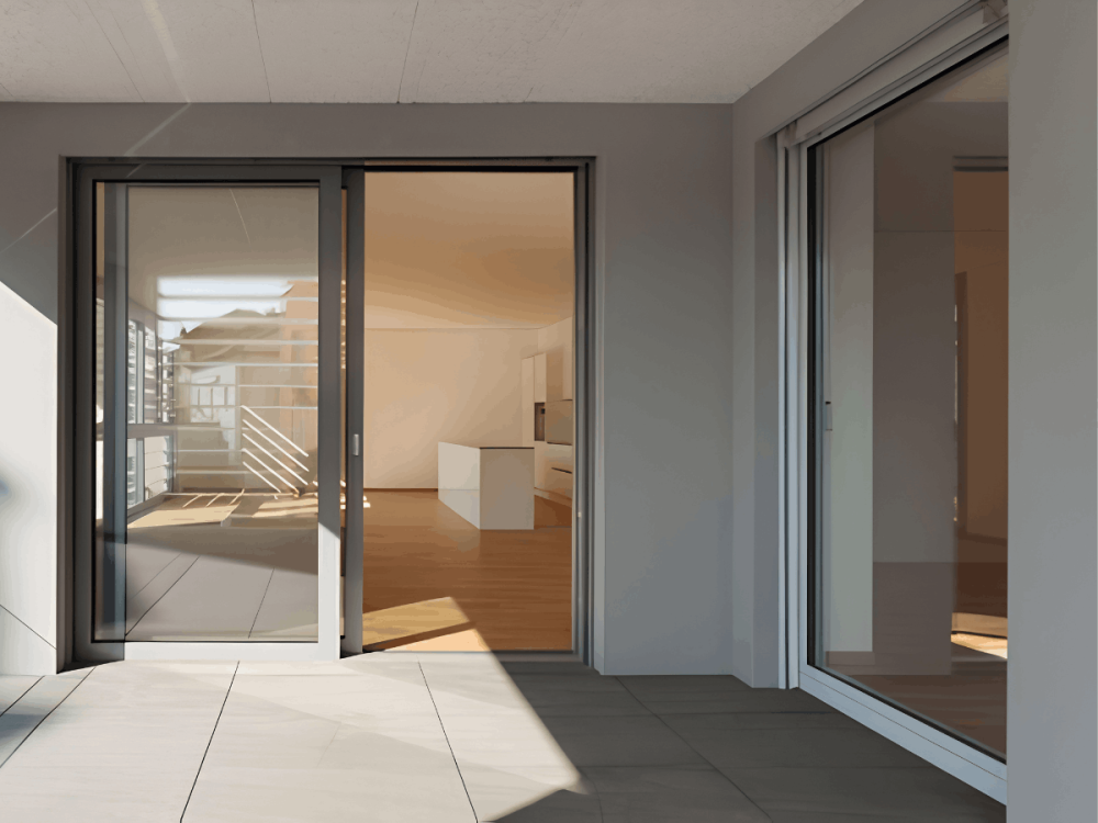 Sliding glass doors opening from an apartment balcony into the living area