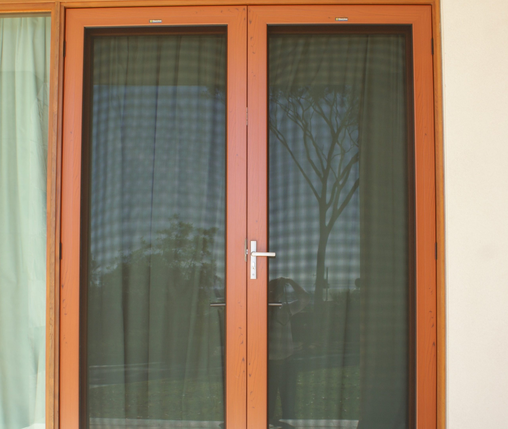 A cropped image of a double security door