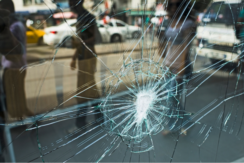 Cracked glass window following a heavy impact