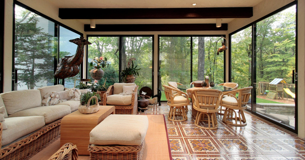 outdoor patio with ceiling to floor glass walls and doors