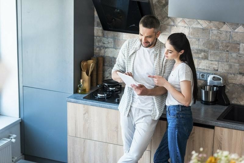 Couple Planning Security System for a New Home